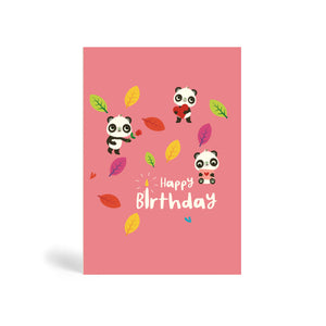 A6 pink eco-friendly, tree free, birthday greeting card showing three Pandas enjoying a birthday party surrounded by autumn leaves. One Panda is holding a red rose, another is holding a heart shape and the third one is holding a greeting card in an envelope. The card says, Happy Birthday.