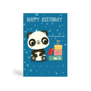 Blue with circle pattern background A6 eco-friendly, tree free, birthday greeting card showing Panda sitting beside a pile of present with birthday cake and candles on top. The card says, Happy Birthday. It’s time to make a wish.