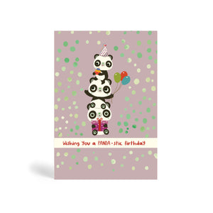 A6 Purple grey with dots background eco-friendly, tree free, birthday greeting card with three Pandas Piggyback on top of each other. The top Panda is wearing a party hat and holding a cake, the middle Panda is holding balloons and the Panda at the bottom is sitting down and holding a purple present. The card says, wishing you a PANDA-stic Birthday.