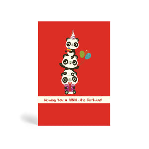 A6 red no dots background eco-friendly, tree free, birthday greeting card with three Pandas Piggyback on top of each other. The top Panda is wearing a party hat and holding a cake, the middle Panda is holding balloons and the Panda at the bottom is sitting down and holding a purple present. The card says, wishing you a PANDA-stic Birthday.