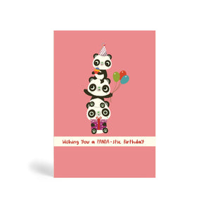 A6 pink no dots background eco-friendly, tree free, birthday greeting card with three Pandas Piggyback on top of each other. The top Panda is wearing a party hat and holding a cake, the middle Panda is holding balloons and the Panda at the bottom is sitting down and holding a purple present. The card says, wishing you a PANDA-stic Birthday.