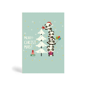 Teal A6 Eco-Friendly Christmas card made from bamboo and cotton linters with image of four Pandas standing on top of each other helping to decorate a snow-covered Christmas tree with a pile of presents at the foot of the tree. The card says MERRY CHRIST MAS!.