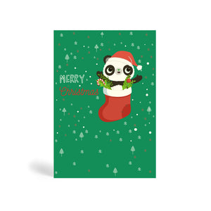 Green A6 Eco-Friendly Christmas greeting card made from bamboo and cotton linter with snowflakes and Christmas tree design background and image of Panda in stocking filled with candy cane, bubbles and mistletoe Santa hat. The card says, MERRY CHRISTMAS.