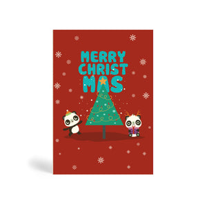 Red A6 Eco-Friendly, recyclable, biodegradable, green, tree-free Christmas greeting card made from bamboo and cotton linter with snow in the background and image of a green Christmas tree with a star on top and two Pandas. One Panda standing wearing Santa hat and pointing at tree and the other one sitting down holding a purple present. The card says, MERRY CHRIST MAS.