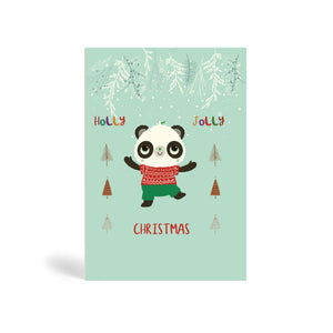 Teal A6 Eco-Friendly greeting card made from bamboo and cotton linter with an image of Panda wearing a red Christmas sweater and green trouser excited about Christmas with branches covered in snow above him and stylised Christmas trees to his right and left. The card says, Holly Jolly, Christmas.