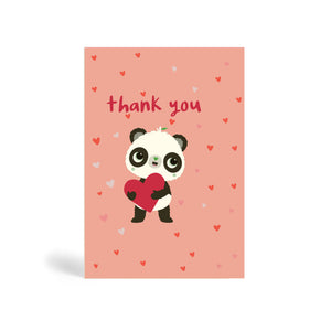 A6 eco-friendly dusty pink ‘Puppy Eyes’ Panda thank you card with Panda holding a red heart shape surrounded by floating small heart shapes and saying a cute thank you. Panda Joy, environmentally friendly, tree free greeting cards.